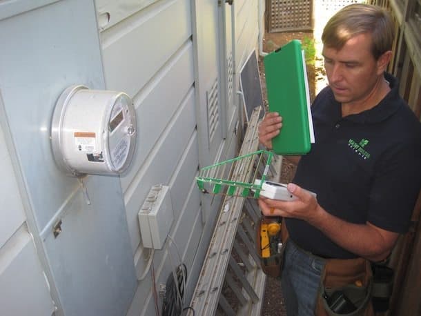 man using Directional RF Antenna at Smart Meter - Healthy Building Science - RF Testing