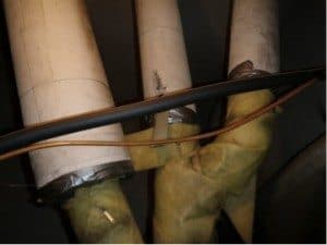 Asbestos over fiberglass insulation